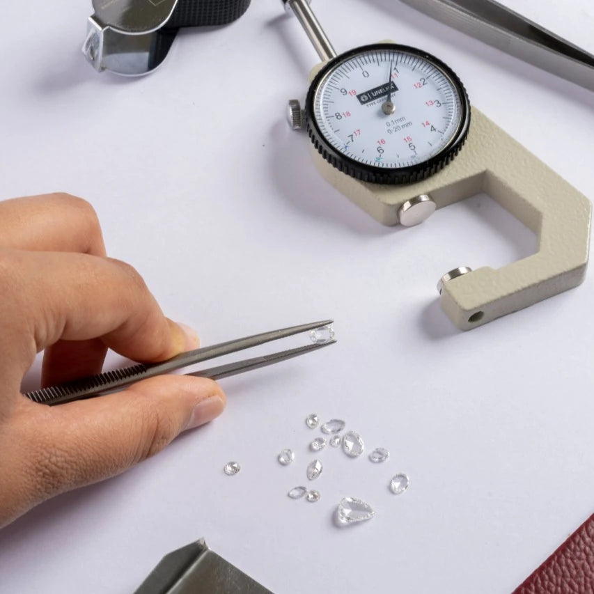 A jeweller working with precision tools