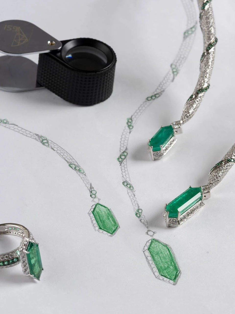MEIR jewellery, sketches and a loupe